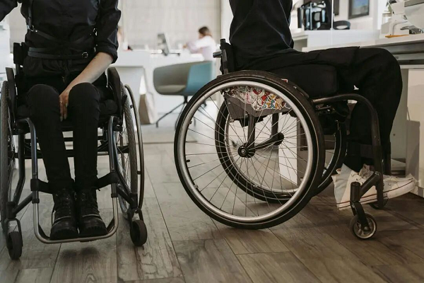 Why are wheelchairs designed with the front higher than the back?! Aren't they afraid the user will fall?